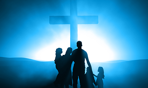 Family at the Cross Silhouettes of a family at the Cross of Jesus.